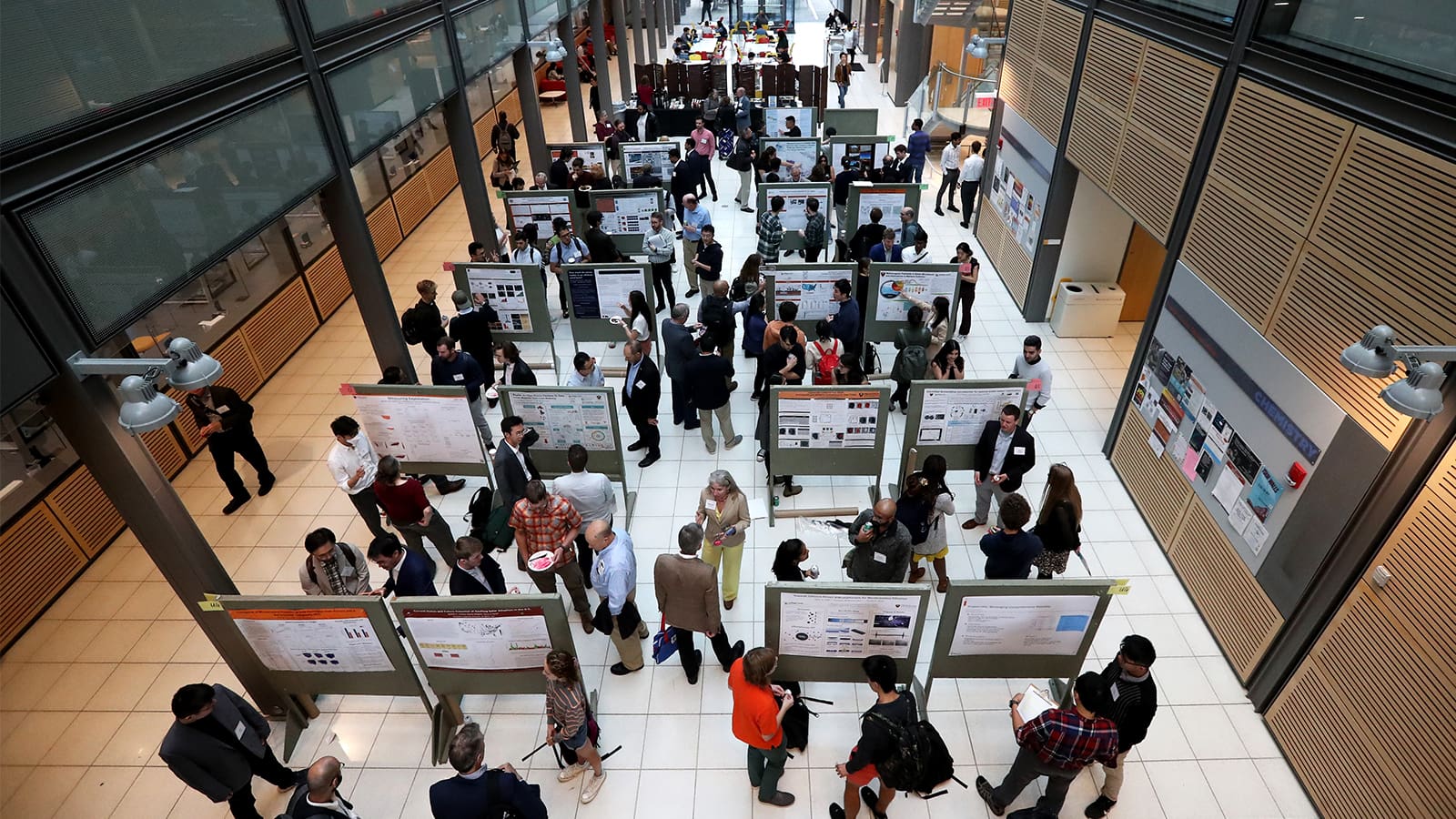 Over 50 undergraduates, graduate students, and post-docs presented their research at a poster session that filled the Frick Chemistry Lab atrium.